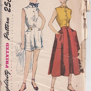 May include: A vintage Simplicity sewing pattern envelope 3160, size 12, bust 30. The illustration shows two outfits: a white sleeveless collared romper with a neck scarf and a yellow sleeveless collared blouse paired with a red pleated midi skirt.