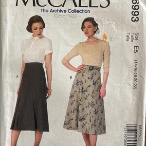 May include: Vintage McCall's sewing pattern, M6993, from The Archive Collection, circa 1933. The pattern features two skirt designs, with size E5 (14-16-18-20-22). The image shows illustrations of the finished garments.
