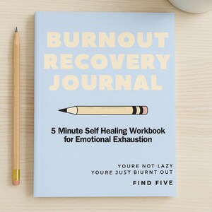 May include: A light blue journal titled "BURNOUT RECOVERY JOURNAL" with a pencil illustration. The journal includes the text "5 Minute Self Healing Workbook for Emotional Exhaustion" and "YOURE NOT LAZY YOURE JUST BIURNT OUT FIND FIVE". A wooden pencil is on the left.