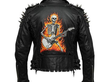 May include: Black leather jacket with silver spikes on the shoulders. The back features a graphic of a skeleton playing a guitar in front of flames. The jacket has a zipper closure and distressed detailing.