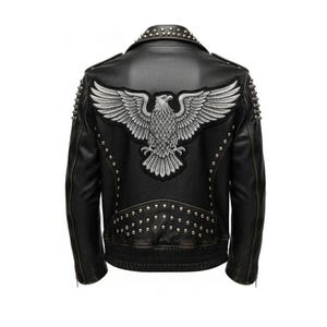 May include: Black leather jacket with silver stud accents and an embroidered eagle patch on the back. The jacket features a classic biker style with a notched collar and zipper details. A stylish outerwear piece.