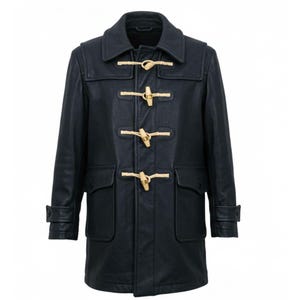 May include: A dark navy blue leather duffle coat with a classic design. The coat features wooden toggle closures, two front pockets, and a collared neckline. The coat has long sleeves with buttoned cuffs.