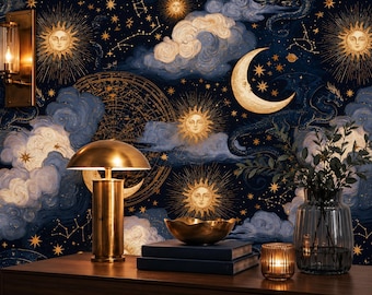 May include: A dark blue wallpaper featuring gold celestial motifs including suns, a crescent moon, stars, and constellations amidst swirling clouds. A brass mushroom lamp, a brass bowl on two books, a glass vase with greenery, and a candle sit in front.