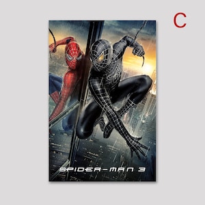 May include: A poster featuring two Spider-Man characters. One is in a classic red and blue suit, the other in a black suit. The background shows a cityscape with rain and the text "SPIDER-MAN 3".