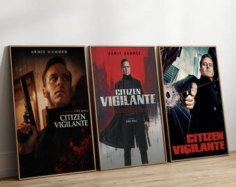 May include: Three framed movie posters for Citizen Vigilante featuring Armie Hammer. The left poster shows a close-up with a handgun, the centre poster displays a full-length figure in a black coat on a red background, and the right poster depicts a gun.
