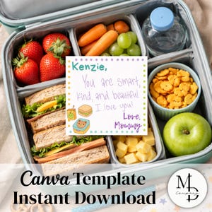 May include: A teal lunchbox containing strawberries, sandwiches, carrots, grapes, crackers, cheese cubes, and a green apple. A note says "Kenzie, You are smart, kind, and beautiful. I love you! Love, Mommy." The text "Canva Template Instant Download" is also visible.
