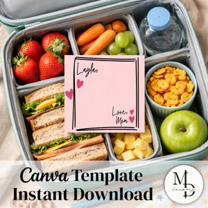 May include: A packed lunch box with a variety of foods, including sandwiches, strawberries, carrots, grapes, and cheese cubes. A pink note with the text "Layla, Love, Mom" is included. The lunch box also contains a bottle of water and snacks.