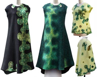 May include: Three sleeveless dresses with abstract green and yellow patterns. The dresses are made of a soft, textured fabric.