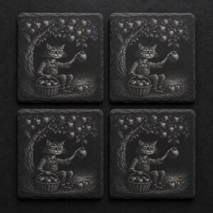 May include: Set of four square slate coasters. Each coaster features a detailed black and white illustration of a cat-like figure picking apples from a tree. The cat is seated with a basket of apples.