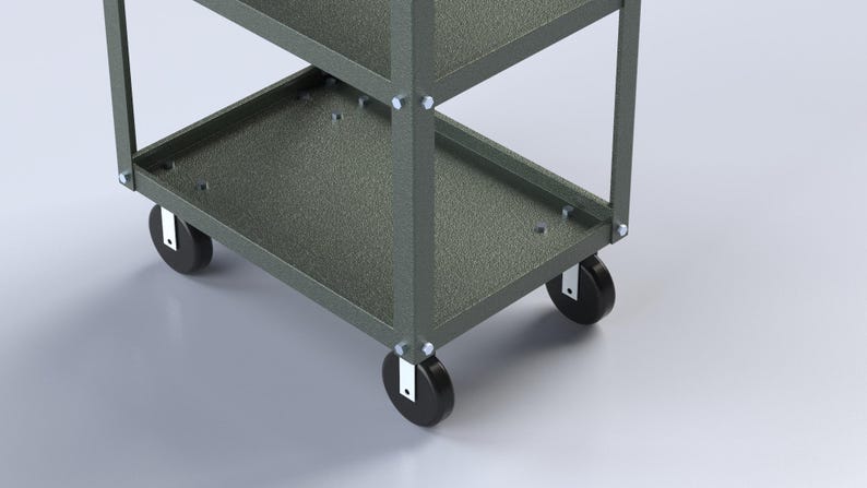 May include: A gray metal utility cart featuring a multi-tiered design with open shelves, vertical support beams, and four black swivel casters attached to the base with silver hardware. The frame has a textured finish and visible bolt connections.