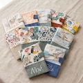 Personalized embroidered baby health record book cover - perfect as a baby gift product logo