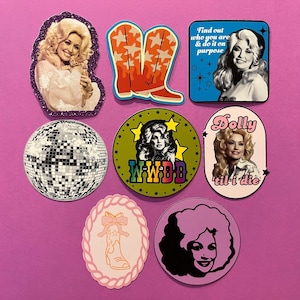 May include: A set of three ceramic mugs with a speckled, matte finish. The mugs are in shades of cream, light brown, and dark brown. Each mug has a simple, minimalist design and a rounded handle.