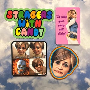 May include: A collection of colorful stickers featuring images and text. One sticker reads "STRAGERS WITH CANDY" in bubble letters. Another shows a woman with the text "I'll make your pinky allll stinky". Other stickers feature the same woman with different images.