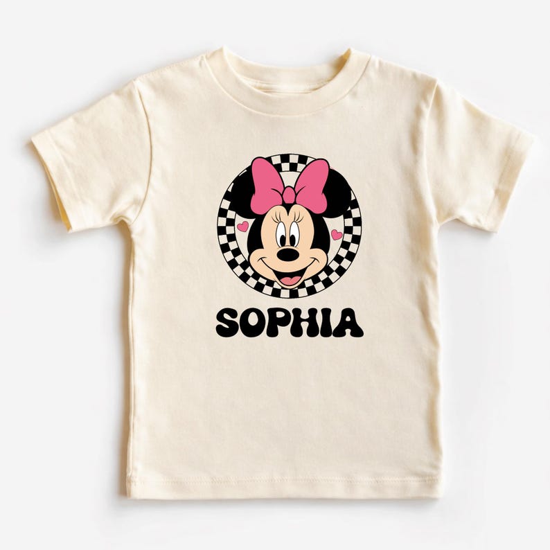 A white t-shirt with a Minnie Mouse graphic and the name "Sophia" printed below it.
