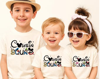 May include: Three off-white short-sleeve t-shirts featuring the black text "Cousin Squad" with colorful character-themed accents. The letter "o" is a Mickey Mouse silhouette, and the letters "S", "Q", "U", "A", "D" incorporate various Disney character motifs.