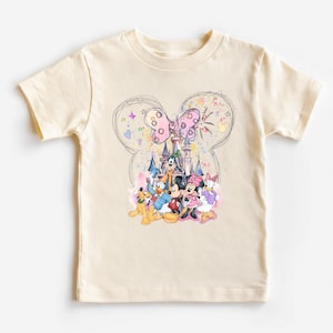 A white t-shirt with a colorful graphic design featuring Disney characters such as Mickey Mouse, Minnie Mouse, Donald Duck, and Goofy.