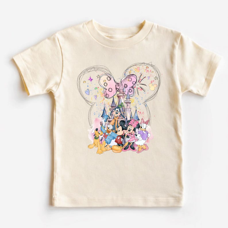 A white t-shirt with a colorful graphic design featuring Disney characters such as Mickey Mouse, Minnie Mouse, Donald Duck, and Goofy.