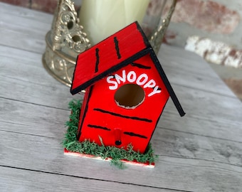 Comedero para pájaros de Snoopy