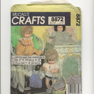 May include: McCall's Crafts sewing pattern number 8872 for a complete baby doll wardrobe. The pattern includes instructions for making a variety of outfits for dolls sized 13-14 inches, 15-16 inches, and 17-18 inches.