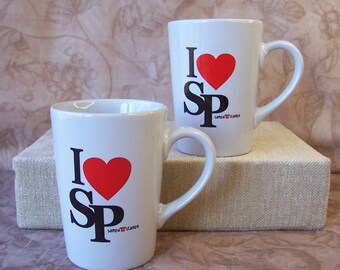 Vintage pair of Sampa Stampa souvenir mugs. B860-2.