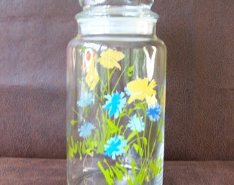 Vintage domed lid glass canister.  Bright colored wildflowers.  B564-.80.