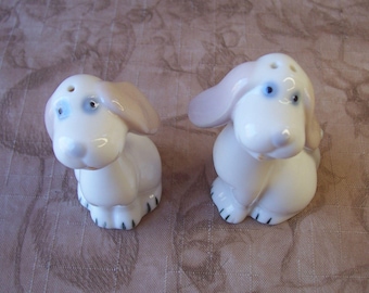 Vintage white porcelain dog salt and pepper shakers.  B892-1.25.