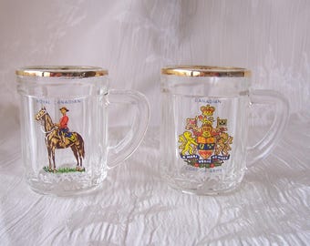 Vintage pair of mini mug shot glasses.  Canadian Mounted Police.  B939-.50.