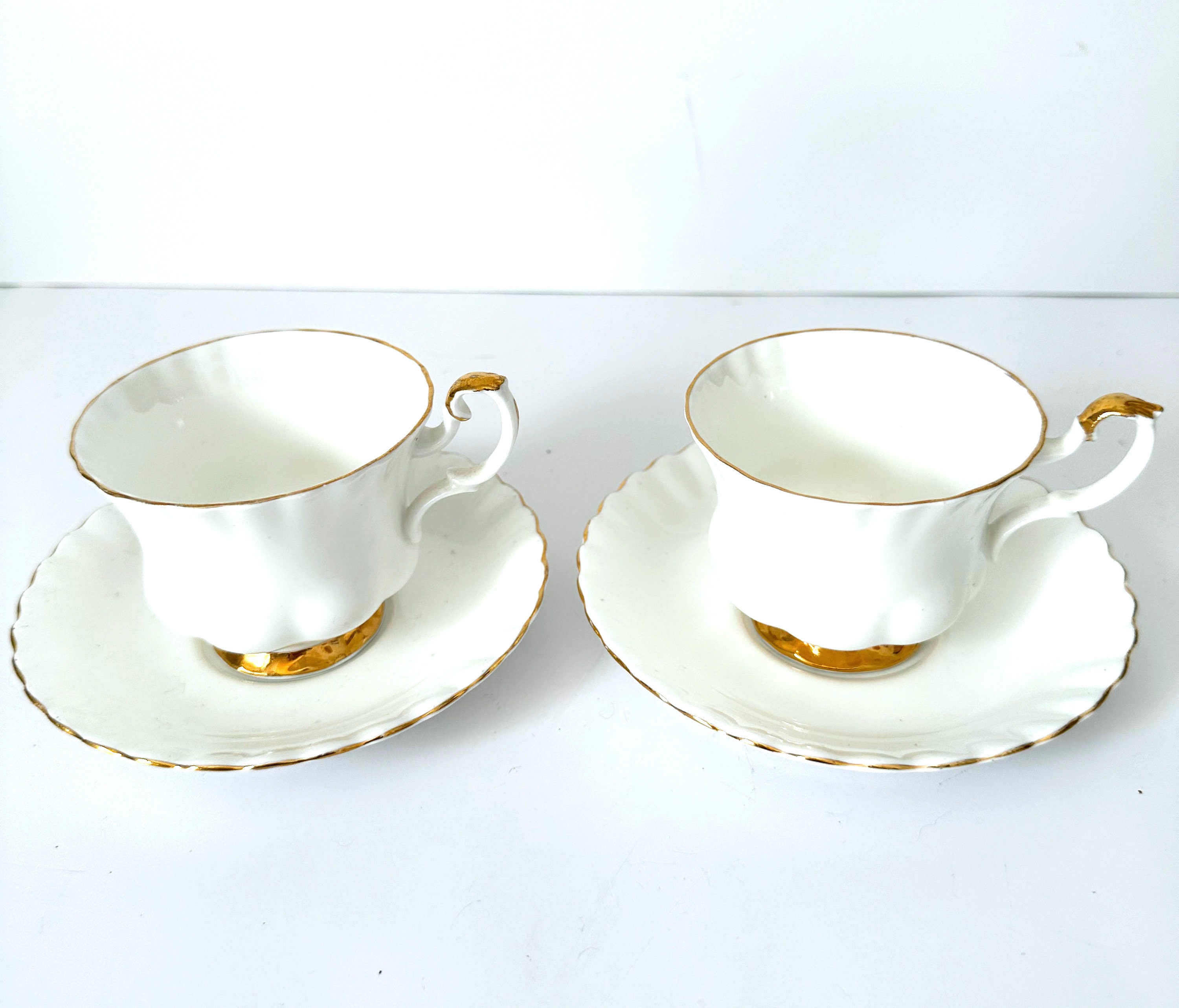 White Empty Tea Cup And Saucer With Simple Pattern Isolated On