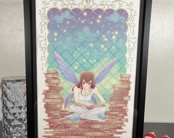 May include: Framed art print featuring a seated fairy with purple wings, reading a book and drinking from a mug. The artwork has a fantasy theme with stacks of books, clouds, and stars in the background. The frame is black.