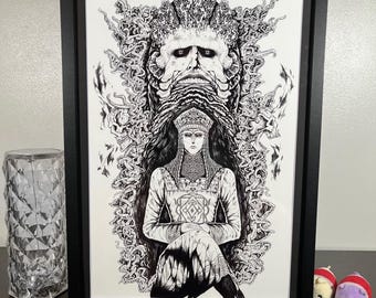 May include: Black and white framed artwork featuring a detailed illustration of a figure in ornate clothing, seated with hands clasped. A large, stylized face with intricate details is above the figure. The artwork is in a black frame.