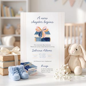 May include: A white baby shower invitation card featuring the text A new chapter begins, a watercolor illustration of stacked books with a bow, and event details for Sabrina Adams on Saturday, December 15th at 245 Meadow Lane, Maplewood.