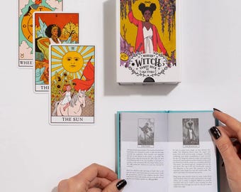May include: A Modern Witch Tarot Deck by Lisa Sterle, featuring colorful illustrations. The deck includes a box with a woman illustration, three tarot cards, and a small book with text and images. The cards depict various figures and symbols.