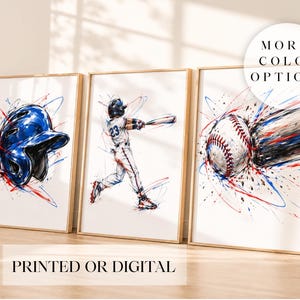 May include: Three framed wall art prints featuring baseball themes with watercolour-style splashes in red, blue, and black. The left print shows a blue batting helmet, the centre shows a batter swinging, and the right shows a baseball in motion.