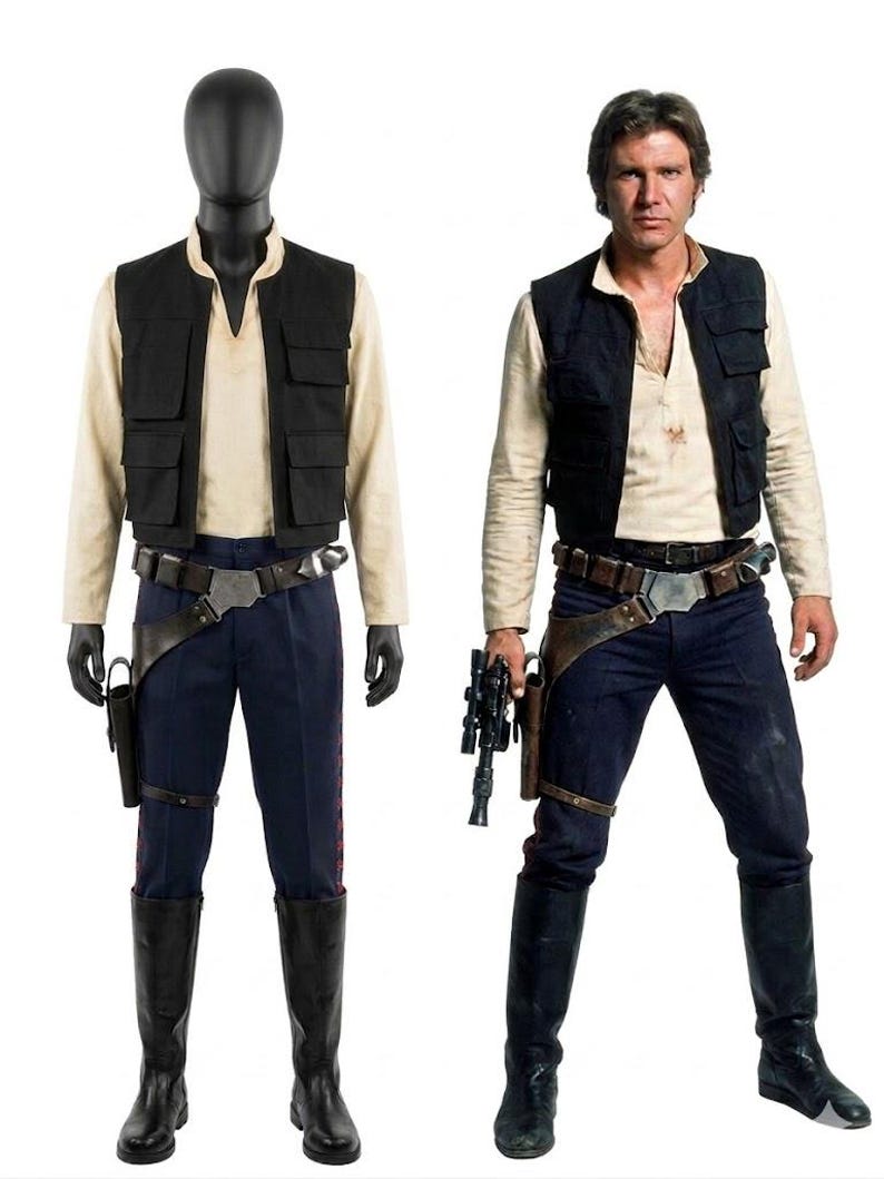 May include: A costume inspired by a science fiction film character. The outfit features a black vest, a cream shirt, dark blue trousers, a belt with a holster, and black boots. The costume is shown on a mannequin and a person.