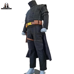 May include: A black costume with a high collar, long sleeves, and a long coat. The costume features a brown belt with a gold buckle and pouches. The pants have quilted knee pads. The costume is likely for cosplay or a themed event.
