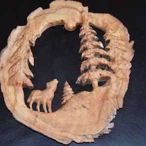 wolf howling at moon - carving