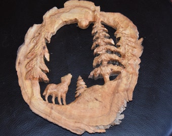 wolf howling at moon - carving