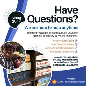 May include: An advertisement with the text "Have Questions?" and "We are here to help anytime!" A photo of a couple is in the corner. Board games are visible on a shelf, including "Ticket to Ride" and "Botany". The website is www.TheRiversideRealm.com.