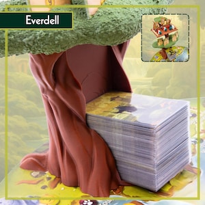 May include: A board game featuring a tree-shaped component supporting a deck of cards. The game is labelled "Everdell" on a green banner. The cards have illustrations, and a small game scene is shown in the background.
