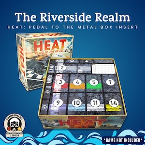 May include: Box insert for the board game "Heat: Pedal to the Metal." The box and insert are tan with the game title and racing car graphics. The insert has numbered compartments with colored stripes.