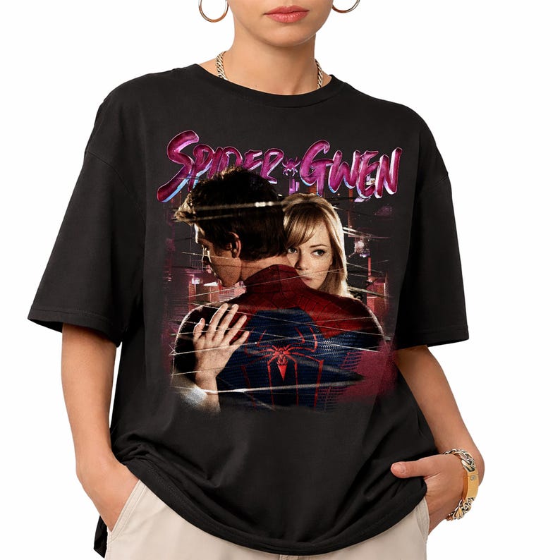 May include: Black t-shirt with a graphic of Spider-Man and Gwen Stacy, with the text "Spider-Gwen" in pink and blue. The design is a vintage style.