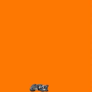 May include: A miniature figurine of a sleeping gray and white cat. The cat is curled up, with its eyes closed. A pink ruler with inch markings is on the right side of the image. The background is a solid orange color.