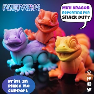 May include: Three colorful mini dragon figurines in orange, yellow, and purple. The orange dragon is in the center, with the text "MINI DRAGON REPORTING FOR SNACK DUTY" in a speech bubble. The text "Print In Place no support" is also visible.