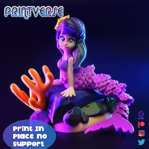 May include: A 3D-printed mermaid figurine with purple hair and a yellow flower. The mermaid is sitting on a rock with coral and a purple tail. The text "Print in Place no support" is visible. The Printverse logo is at the top.