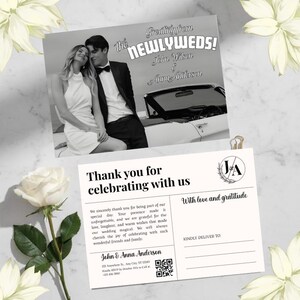 May include: Black and white wedding announcement postcard with the text "Greeting from the NEWLYWEDS!" and "Thank you for celebrating with us." Features a photo of a couple and a classic car.