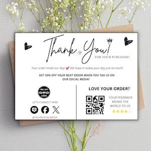 May include: A white rectangular thank you card with black text and graphics. It features the words Thank You! FOR YOUR PURCHASE!, social media icons, a QR code, five yellow stars, and a crown icon. The card includes text about discounts.