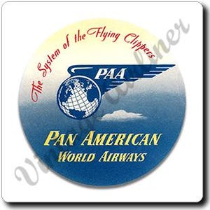 May include: A round, vintage-style sticker with a blue and white globe and the text "PAA" above a stylized wing design. The sticker also features the words "The System of the Flying Clippers" and "Pan American World Airways."