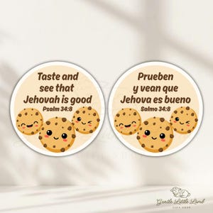 May include: Two round stickers with a light beige background. Each sticker features three smiling cartoon cookies with chocolate chips. One sticker has the text "Taste and see that Jehovah is good" and the other says "Prueben y vean que Jehova es bueno".