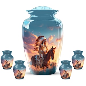 May include: A set of blue cremation urns. The large urn and smaller keepsake urns depict a Native American chief on horseback against a sunset. The urns are made of a glossy material.