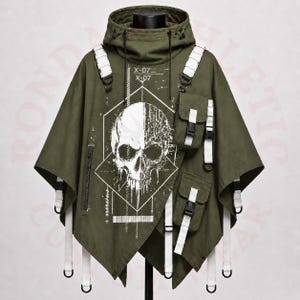 May include: Olive green hooded poncho with a skull graphic. Features white straps, pockets, and a front zipper. The design includes the text "X-07". This unique garment blends streetwear with a gothic aesthetic.